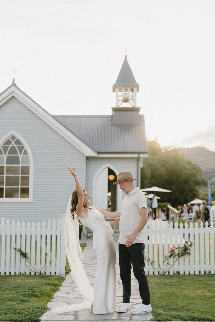 bride & Groom celebrating outside church