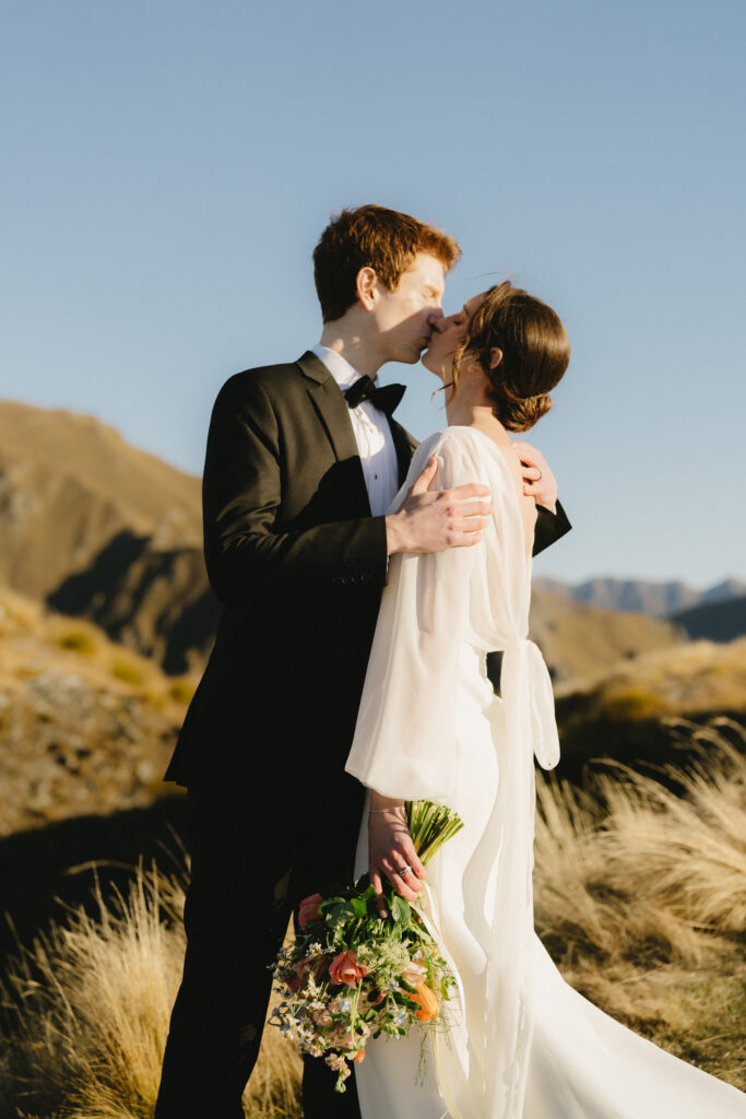 Just married couple share first kiss