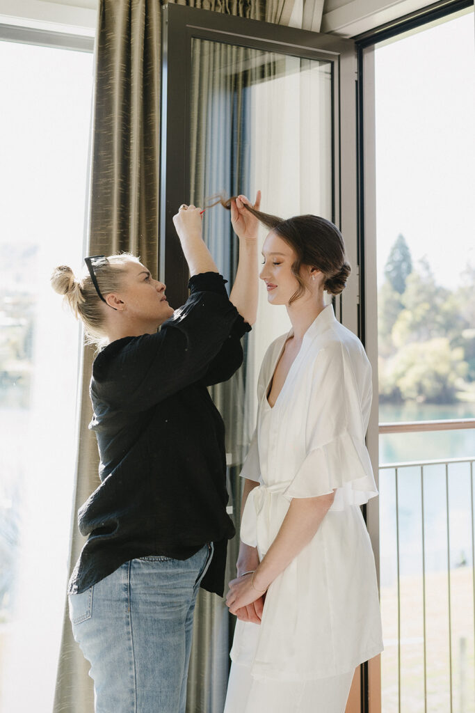 Queenstown getting ready wedding photos, bride getting make up done